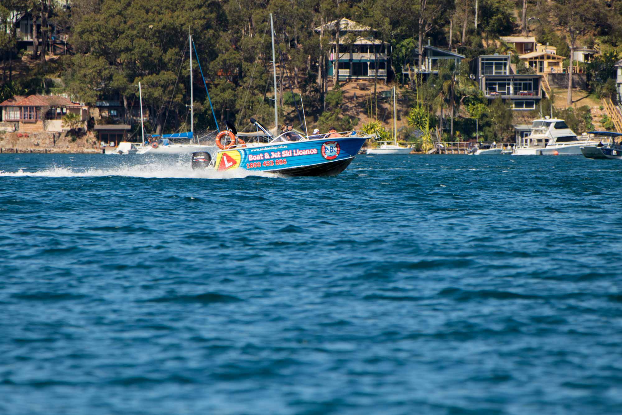 An ABC Training Boat on the wide open waters of Pittwater in Newport